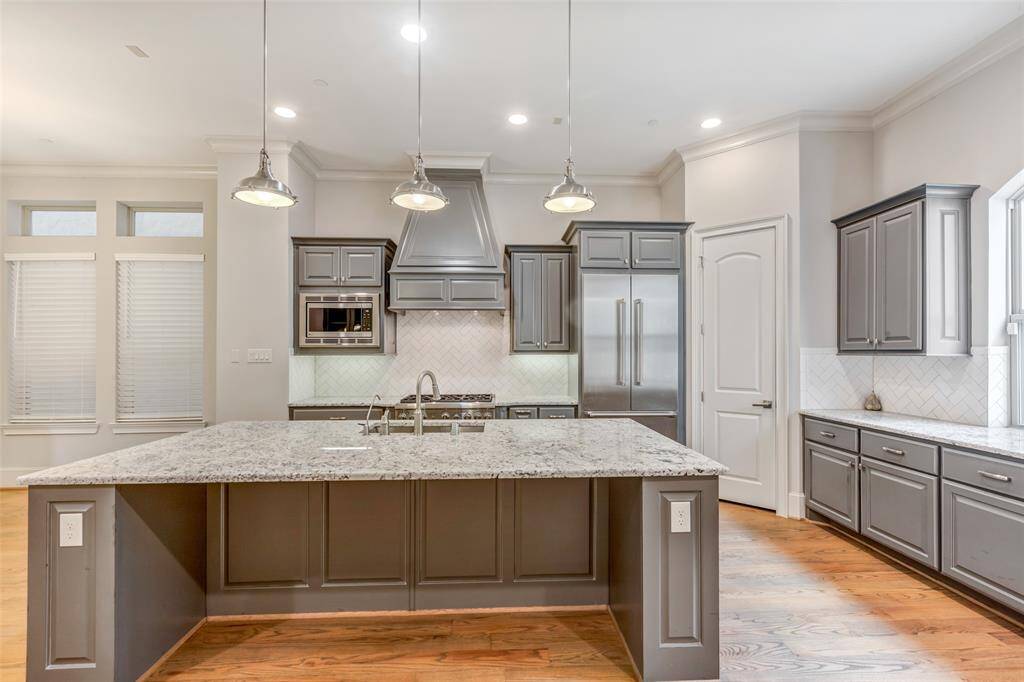 The spacious island comes complete with electrical points to utilize the space for small cooking appliances.