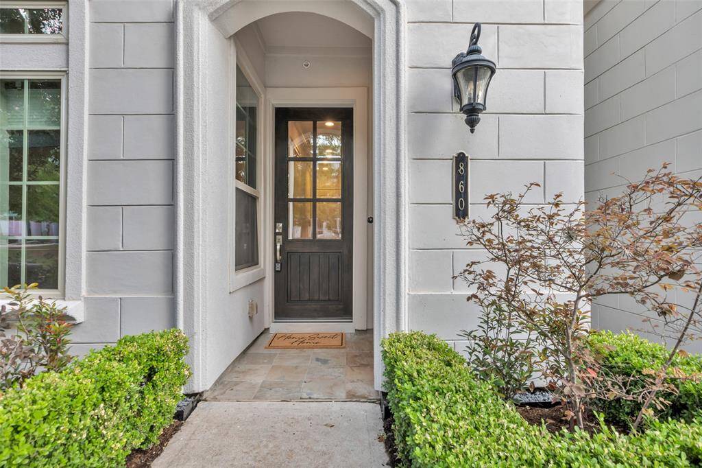 This stunning covered Porch welcomes guests to this home