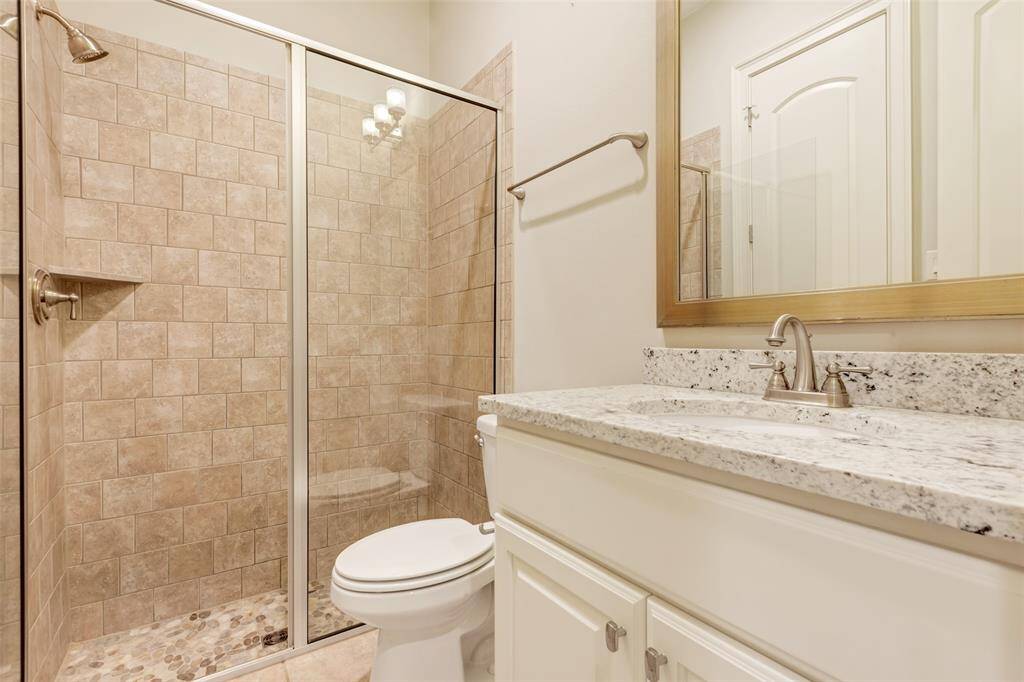 Full bathroom for guest suite on first floor.