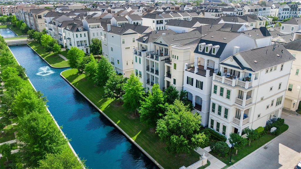 Who would not want to live in this Elegant European influenced community complete with lush greenery and canals. Our home second from the right here in a beautiful black & white finish.