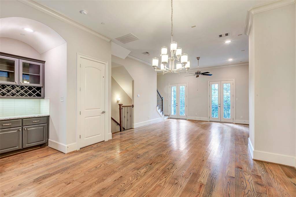 Fitted cabinetry complete with wine rack with additional counter space add elegance to this dining area.