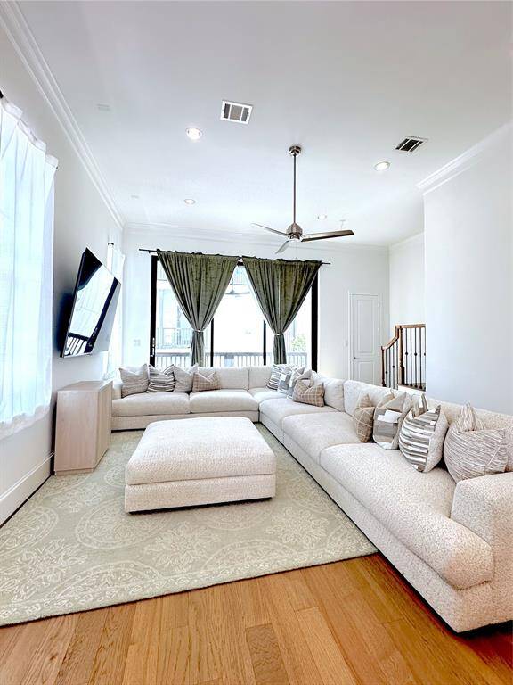 This spacious living room offers abundant natural light and direct access to outdoor living, perfect for comfort and entertaining.