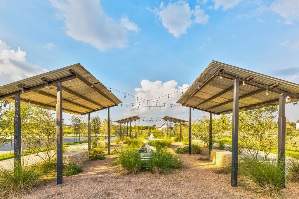 Your dream community awaits. Discover the vibrant lifestyle at Kolbe Farms, showcasing its picturesque lake, inviting pool area, and a vibrant neighborhood setting.