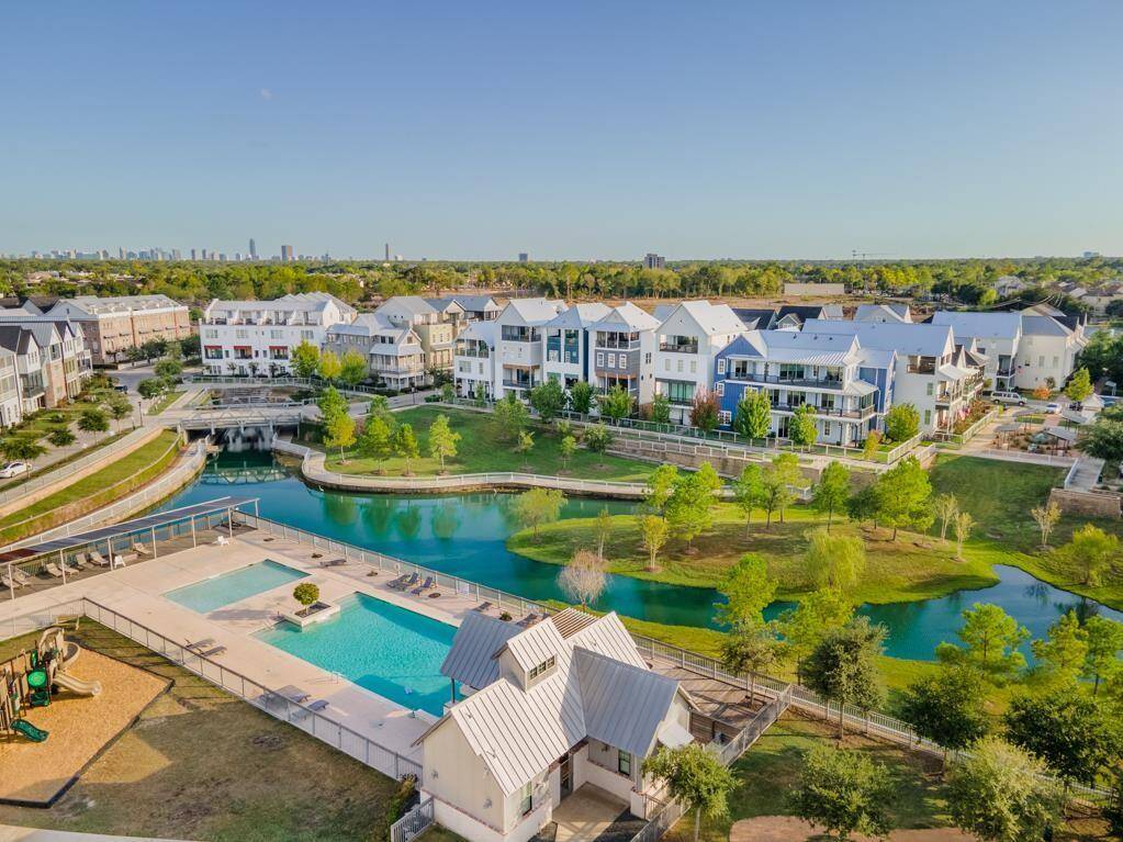 Your dream community awaits. Discover the vibrant lifestyle at Kolbe Farms, showcasing its picturesque lake, inviting pool area, and a vibrant neighborhood setting.