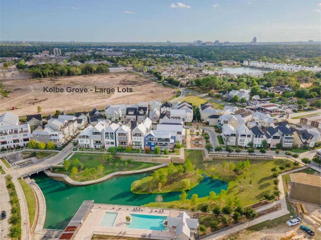 Your dream community awaits. Discover the vibrant lifestyle at Kolbe Farms, showcasing its picturesque lake, inviting pool area, and a vibrant neighborhood setting.