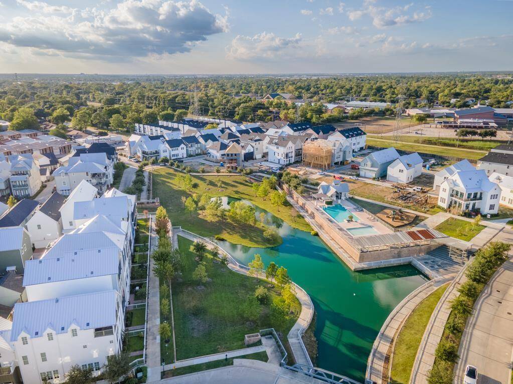 Your dream community awaits. Discover the vibrant lifestyle at Kolbe Farms, showcasing its picturesque lake, inviting pool area, and a vibrant neighborhood setting.