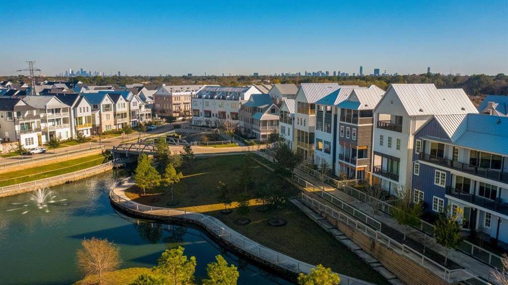 Your dream community awaits. Discover the vibrant lifestyle at Kolbe Farms, showcasing its picturesque lake, inviting pool area, and a vibrant neighborhood setting.