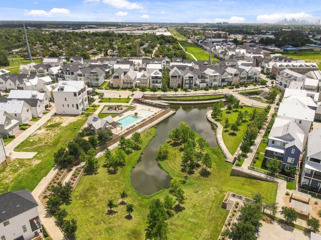 Your dream community awaits. Discover the vibrant lifestyle at Kolbe Farms, showcasing its picturesque lake, inviting pool area, and a vibrant neighborhood setting.