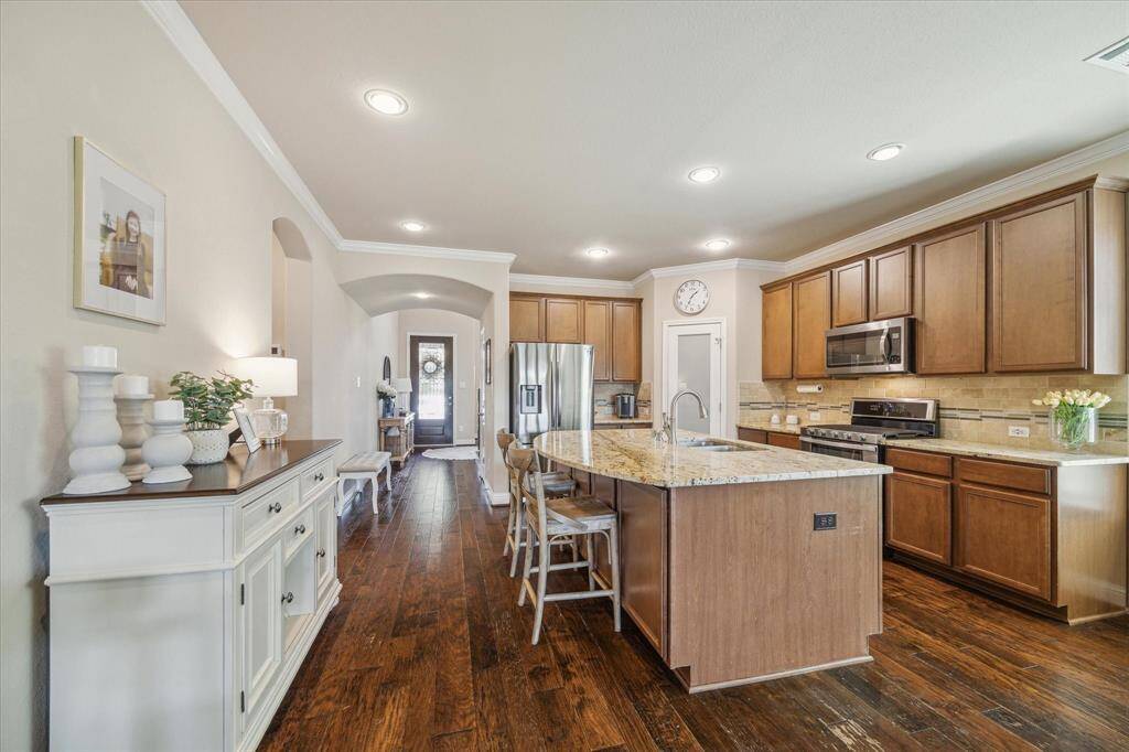 Love this photo showing the gorgeous wood floors all the way to the front door.