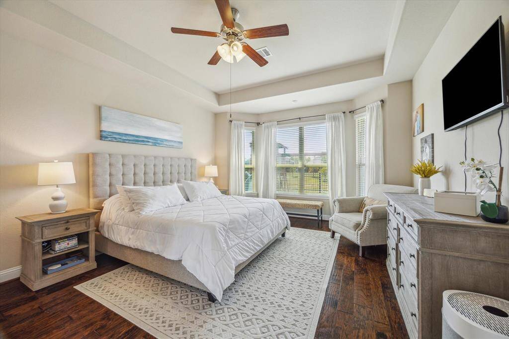 Bright and spacious primary bedroom a large bay window overlooking the back yard and water view.  Total privacy behind.  Bay window allows for cozy seating nook or could accommodate a desk for those that work from home.
