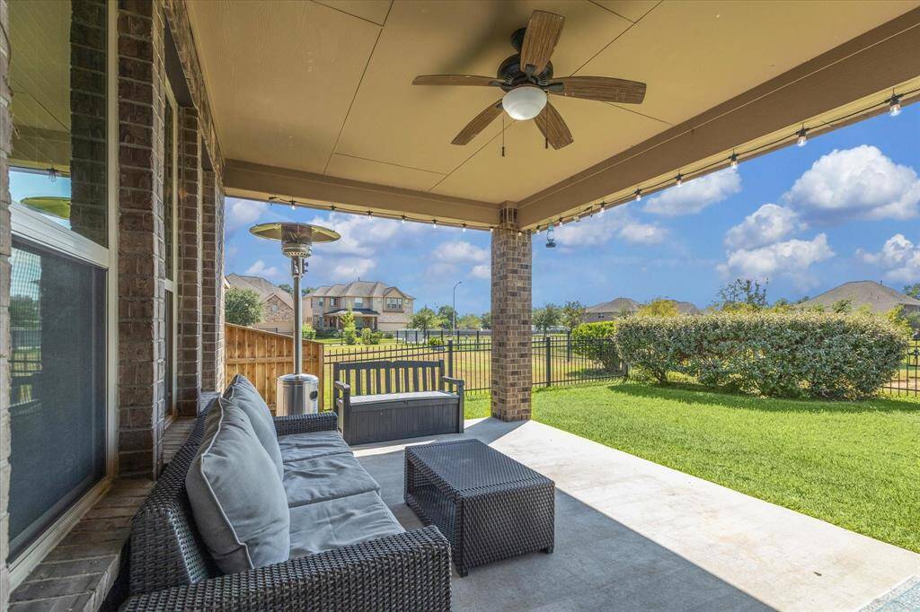 Covered patio with a private view of the pond.  Enjoy nature in your own backyard.  Mature landscaping and well-maintained backyard. Perfect for outdoor relaxation and entertaining.