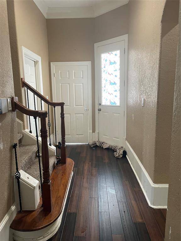 View of secondary stairway and back door