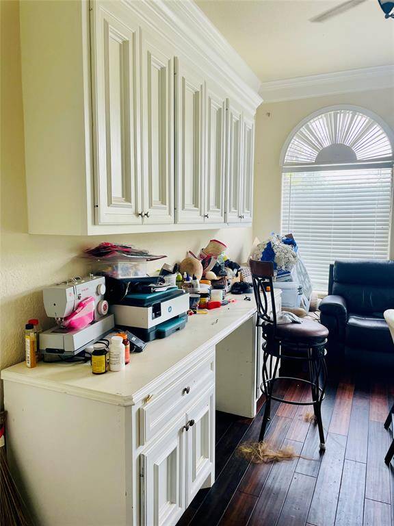 Built-in Cabinets and desk in home office.  Hard wood floors