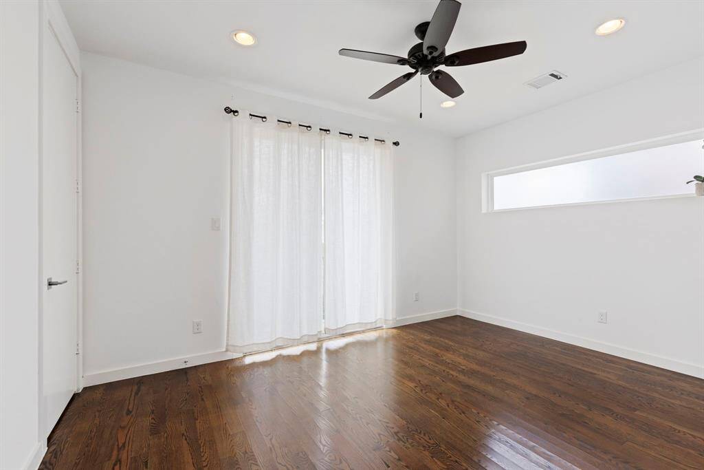 Flex room on first floor, full bath with closet and balcony. May be used for bedroom, home office, guest suite, workout space. Versatile to suit your lifestyle!
