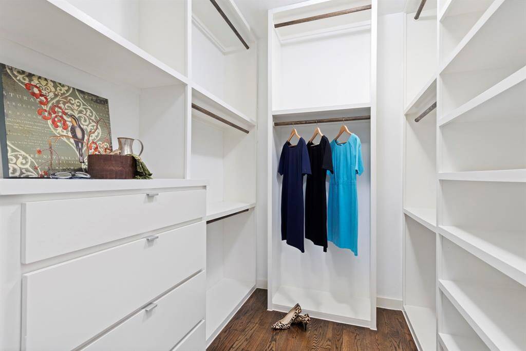 Impressive Primary closet with pullouts and well organized spaces. A place for everything!