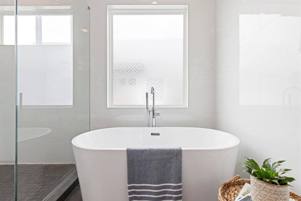Spa like setting with floating bath tub and seamless shower.