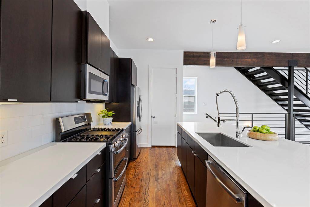 Kitchen view looking toward pantry. Clean lines, balanced color.