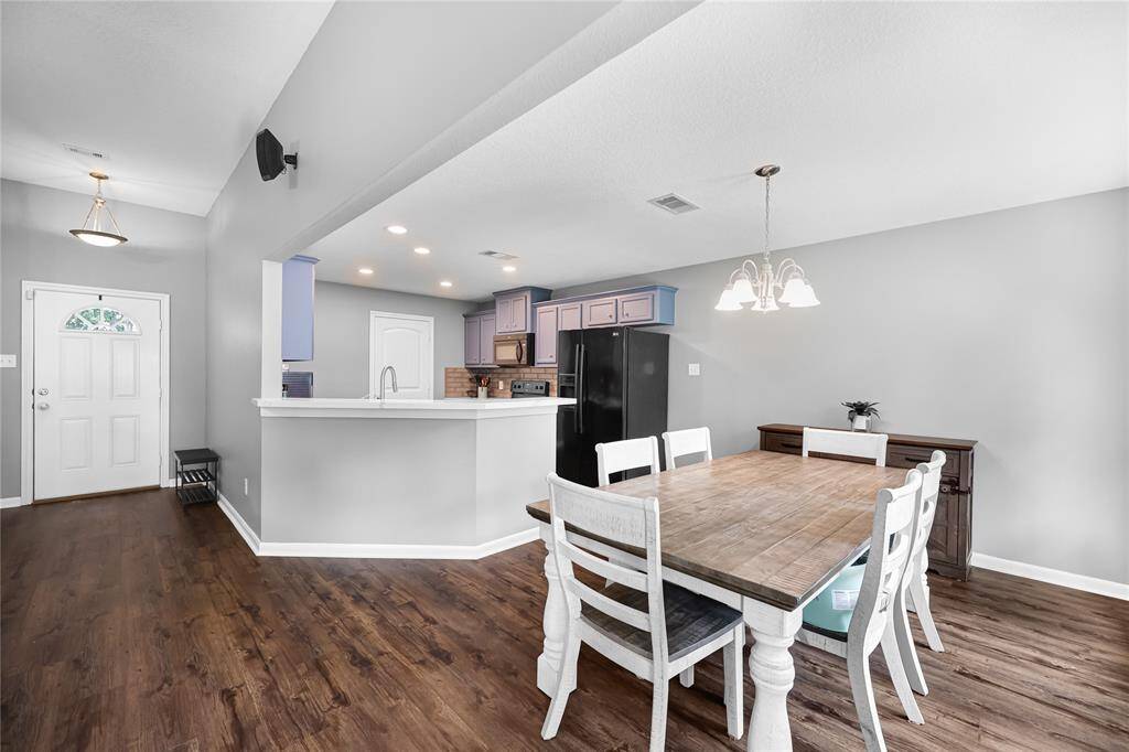 Open floorplan with kitchen, dining, and living wide open