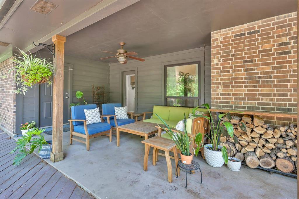 The covered patio that leads to the BIG over sized backyard deck.