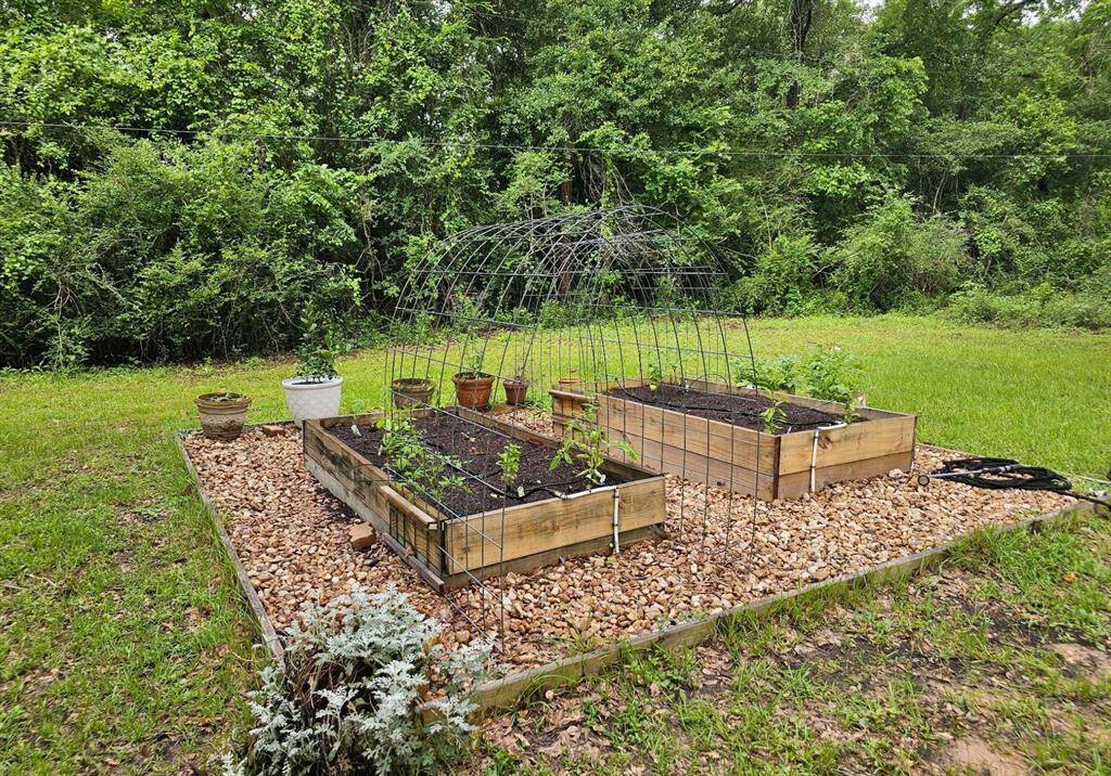 Two raised gardening beds are waiting for your green thumb.