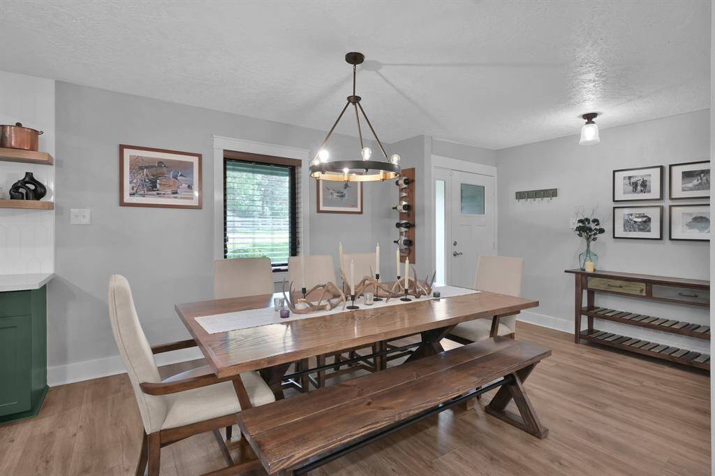 Warm luxury vinyl plank flooring throughout the home is easy to maintain and great for pets.
