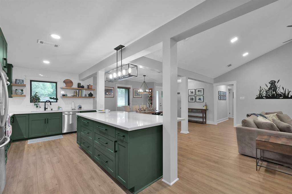 The large center island offers storage and room to gather.