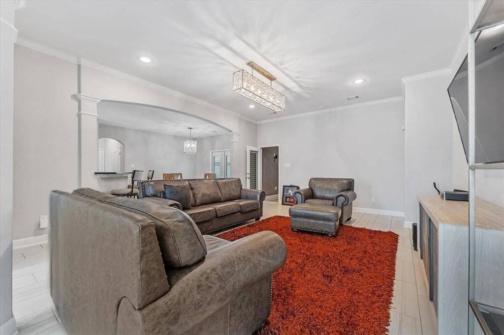 High ceilings with crown molding, stunning light fixture.
