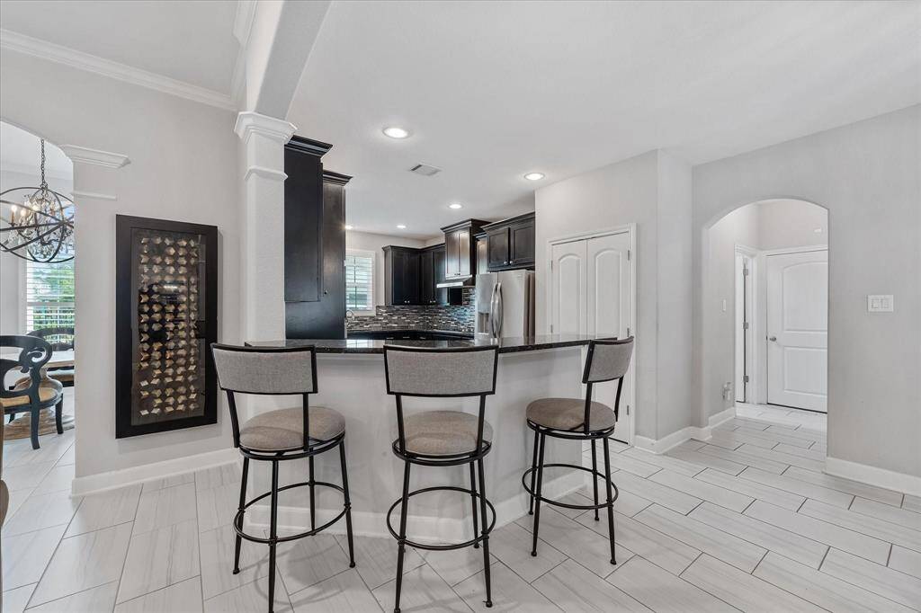 The perfect area to entertain and enjoy your company at the bar.