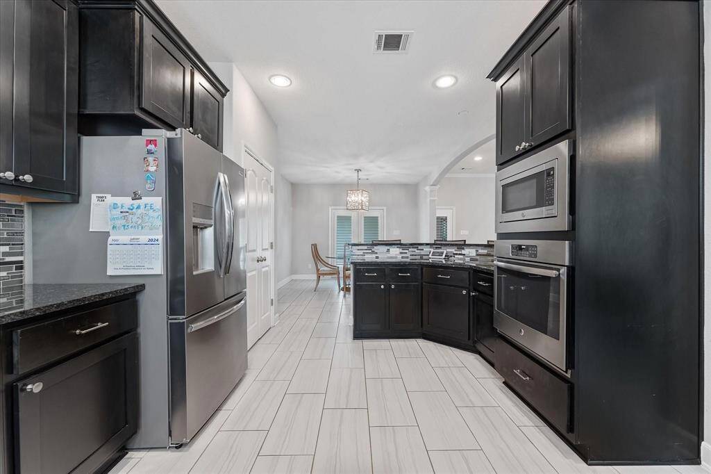 Stainless steel appliances and granite countertops.