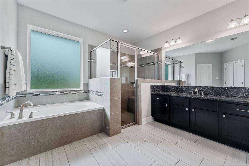 Walk in shower and separate tub.