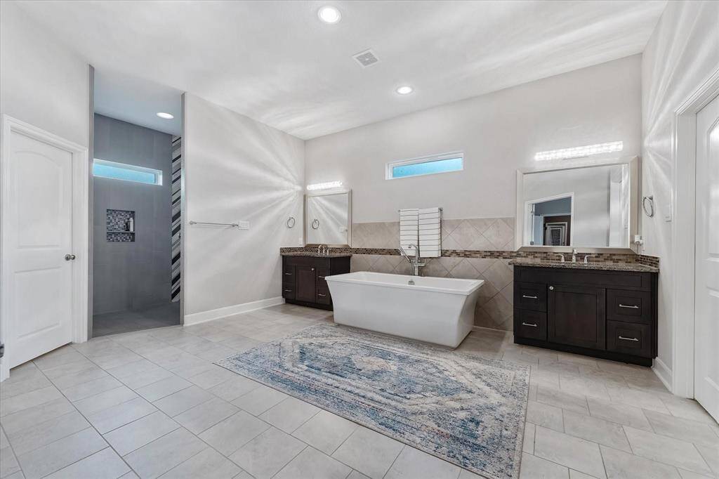 HUGE primary bathroom with separate vanities!