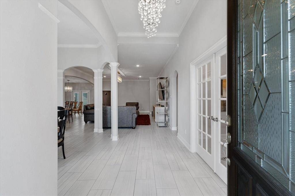 Beautiful entryway leading directly into the formal dining and living room. Office to the right.