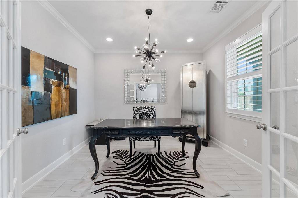 Home office with natural light and double doors!