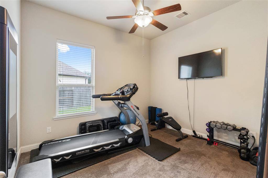 First floor secondary bedroom currently being used as a fitness room.