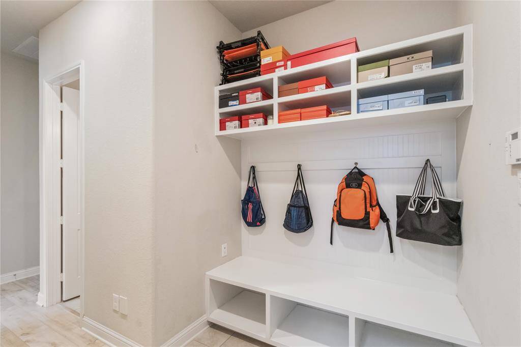 Mud room is located at the entrance of the garage.