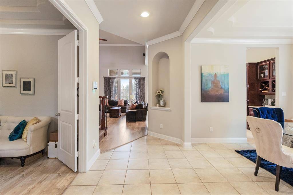 Step inside to be greeted by the foyer which leads you to the home office/study, dining area and living room.