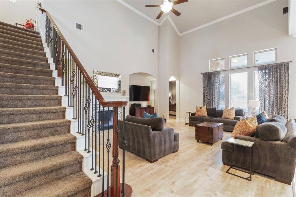 You'll find a spacious living room with high ceilings, and abundant natural light.