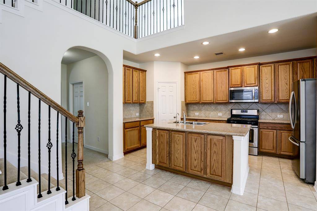 A kitchen made for everyday living— granite countertops, modern finishes, and all appliances included."