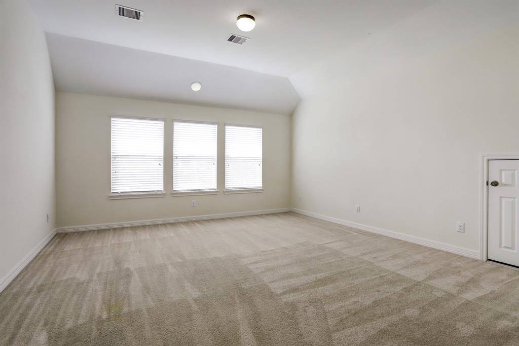 An expansive game room upstairs offers endless possibilities—game nights, movie marathons, or your personal retreat.