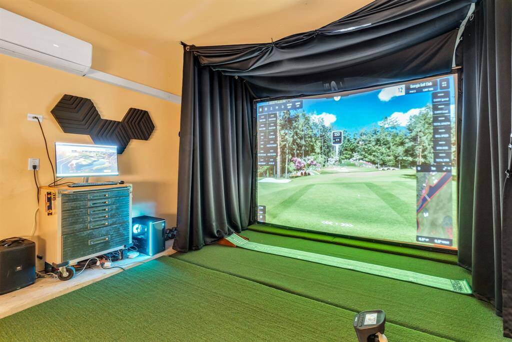 Golf simulator in garage is negotiable