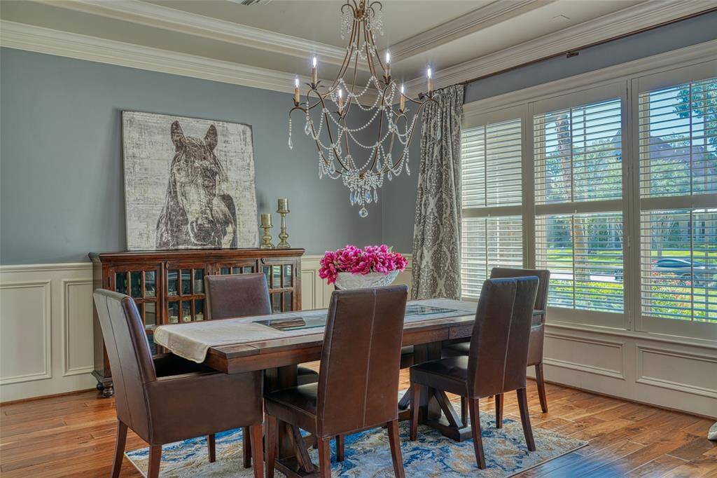 Private Home Office with Double French Doors, Built In Shelves, Wood Flooring and Fresh Paint!