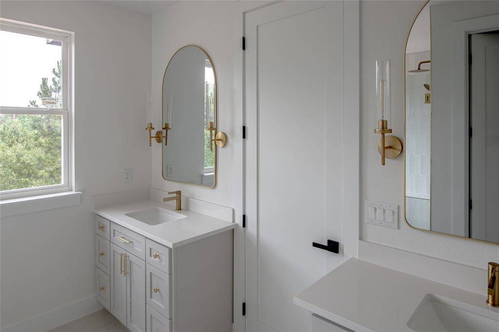 Walk into your primary bathroom and experience luxury.