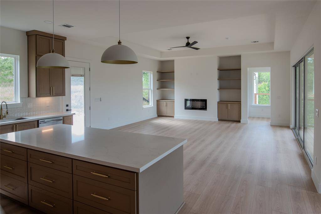 Open living room with extended views into the woods.
