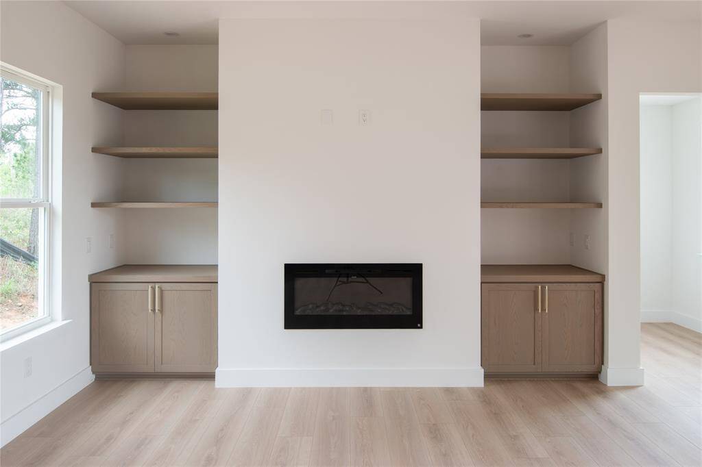 Custom fireplace feature with multi color options.