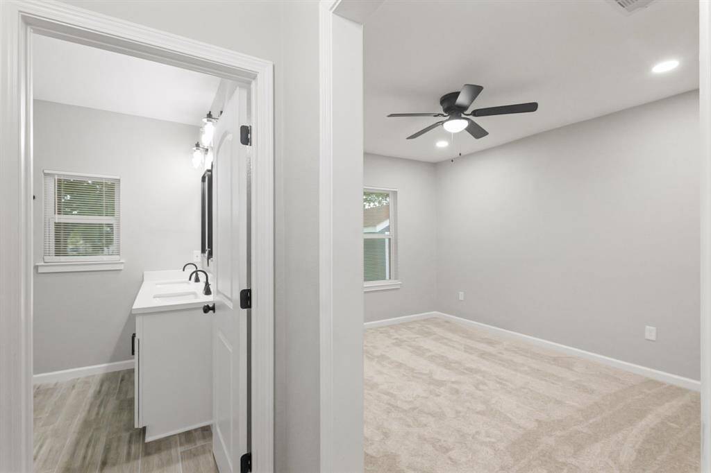 The primary bedroom features its own private ensuite bath, offering comfort, convenience, and a touch of luxury.