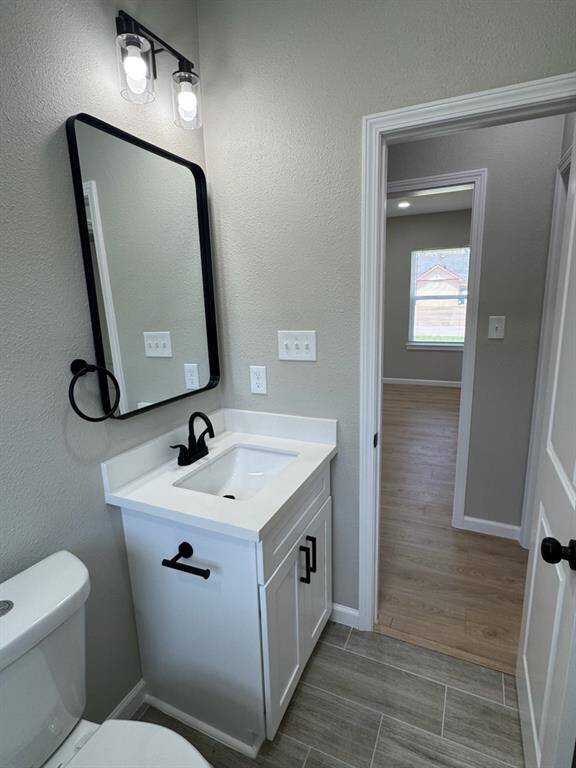 Stylish secondary bathroom vanity paired with a contemporary mirror, offering both function and modern flair.