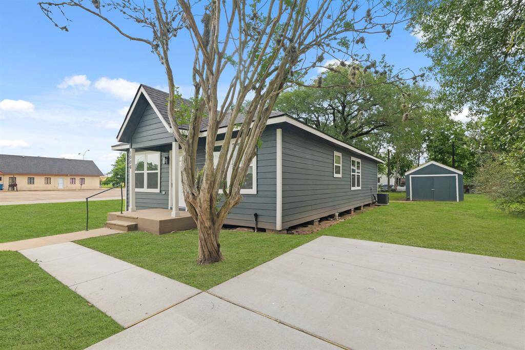 Includes a dedicated concrete parking space for added convenience and functionality.