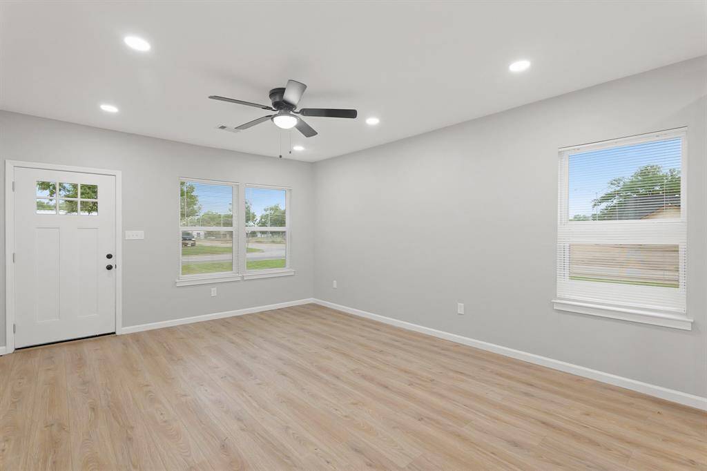 The living area is flooded with natural light, creating a bright and airy atmosphere that invites relaxation and warmth.