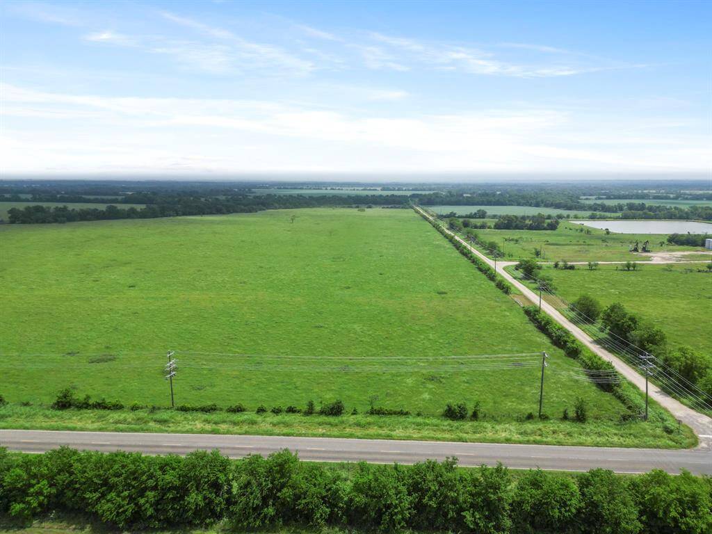 Discover the perfect canvas for your dreams on this stunning 36-acre corner tract, offering sweeping open pastures and exceptional road frontage on two sides.