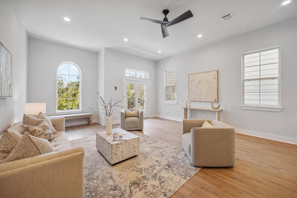 Spacious second floor living offers an open-concept layout with tall ceilings and beautiful natural light.